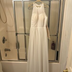 Gorgeous wedding dress. Holter top cream color length to the floor.